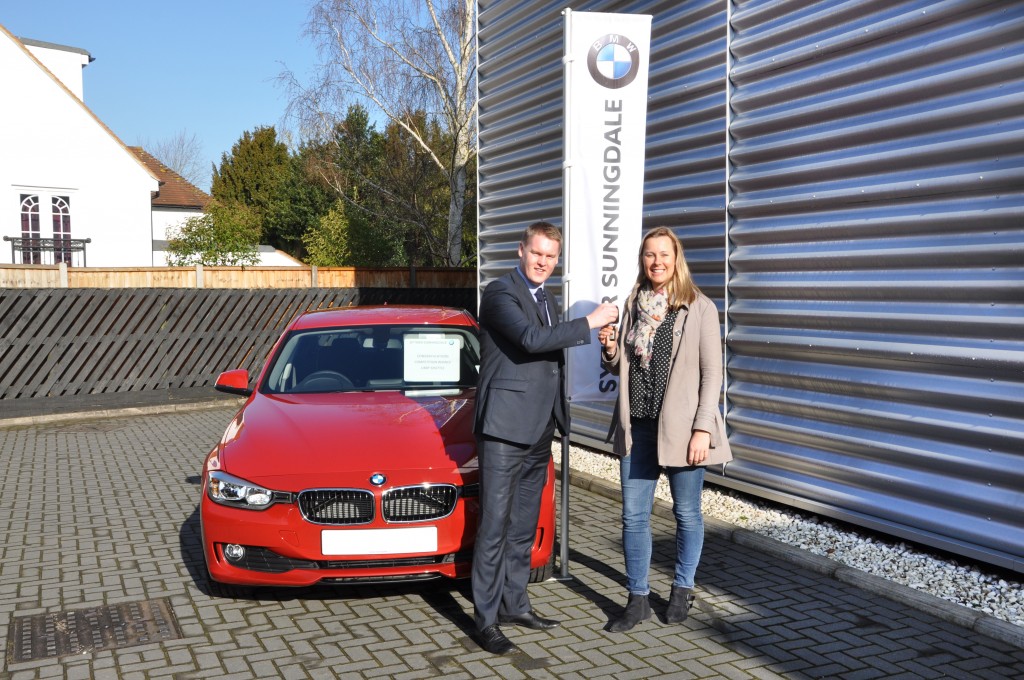 Robert Cross of Sytner Sunningdale giving Libby Shuttle the keys to her brand new car